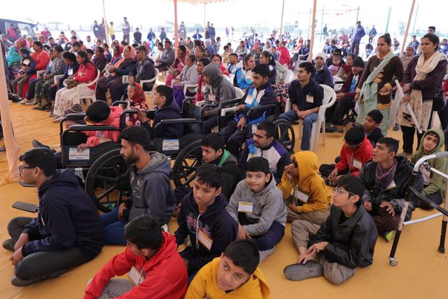 Athletes, including wheelchair users, gather before their events