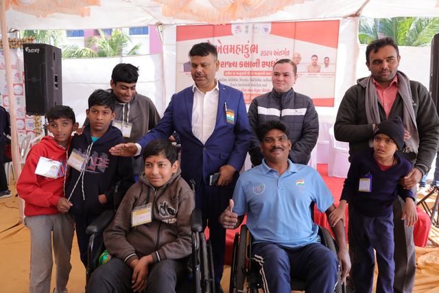 Athletes pose with officials